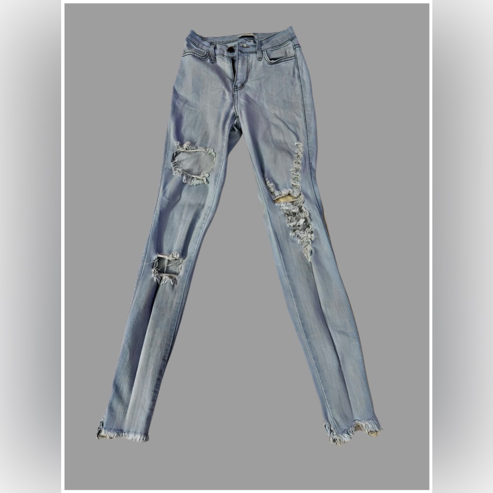 Light blue ripped jeans